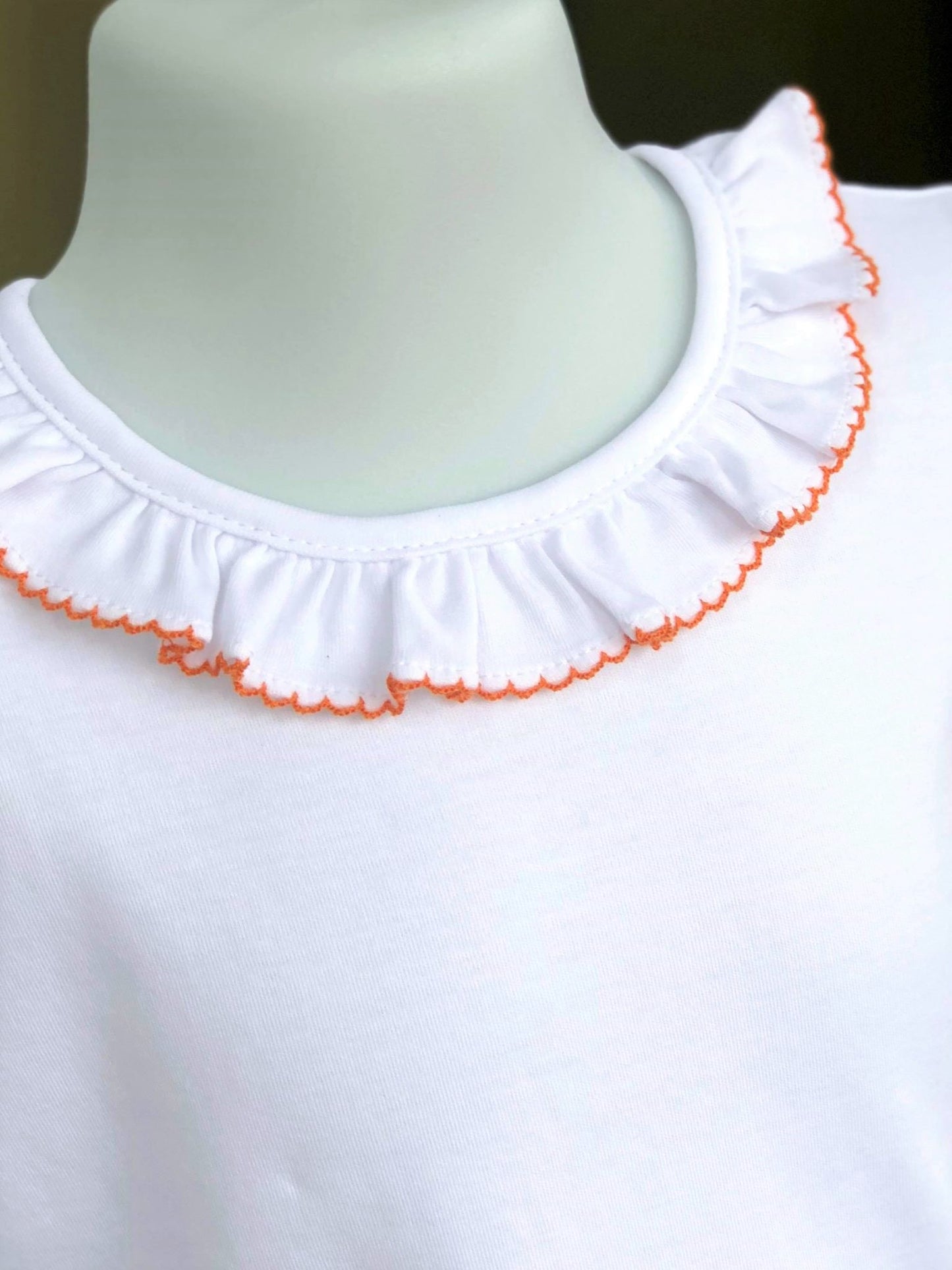 Ruffle collar blouse with orange picot trim*